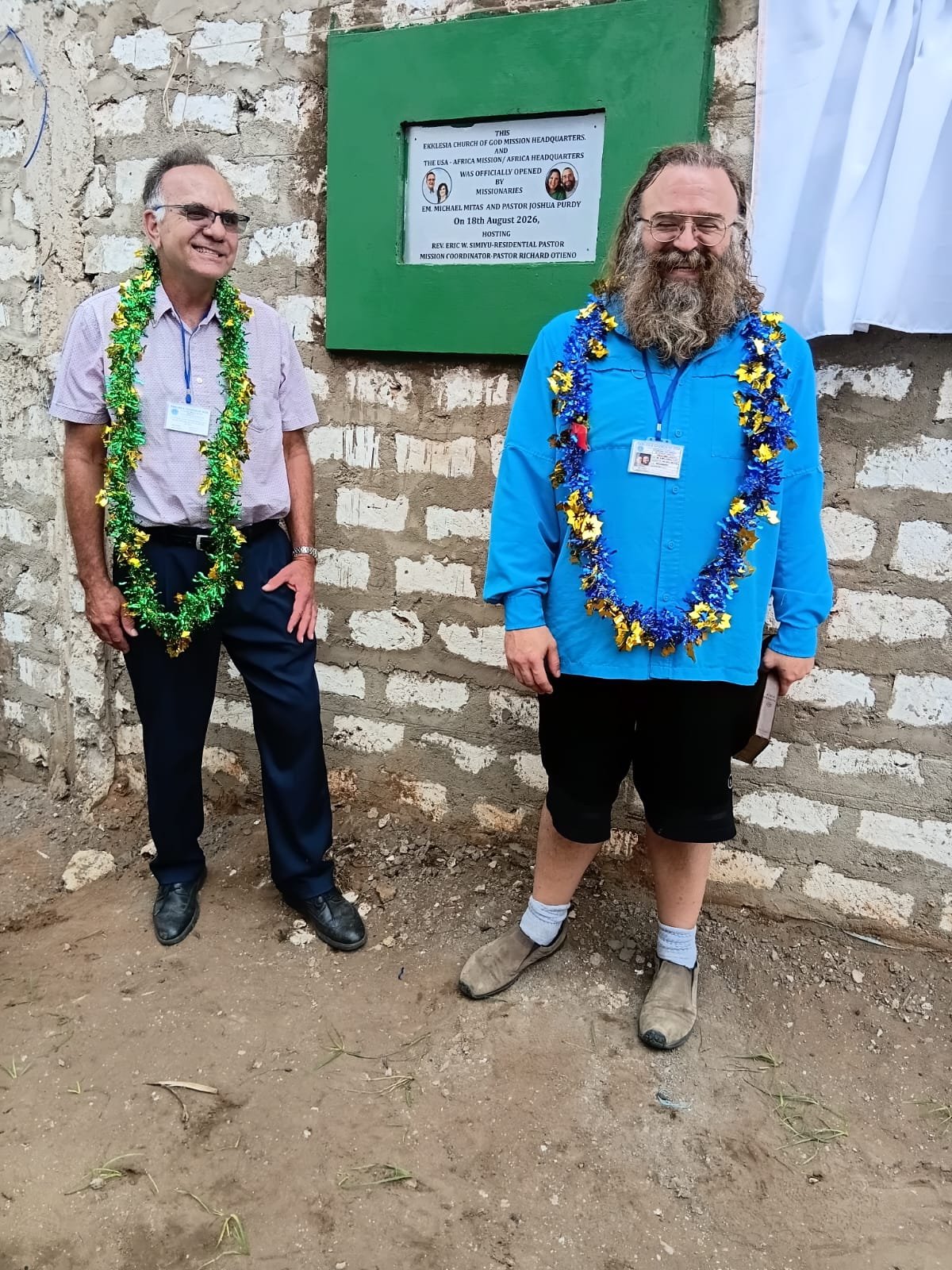 EM Michael Mitas and Pastor Joshua Purdy at the headquarters plaque